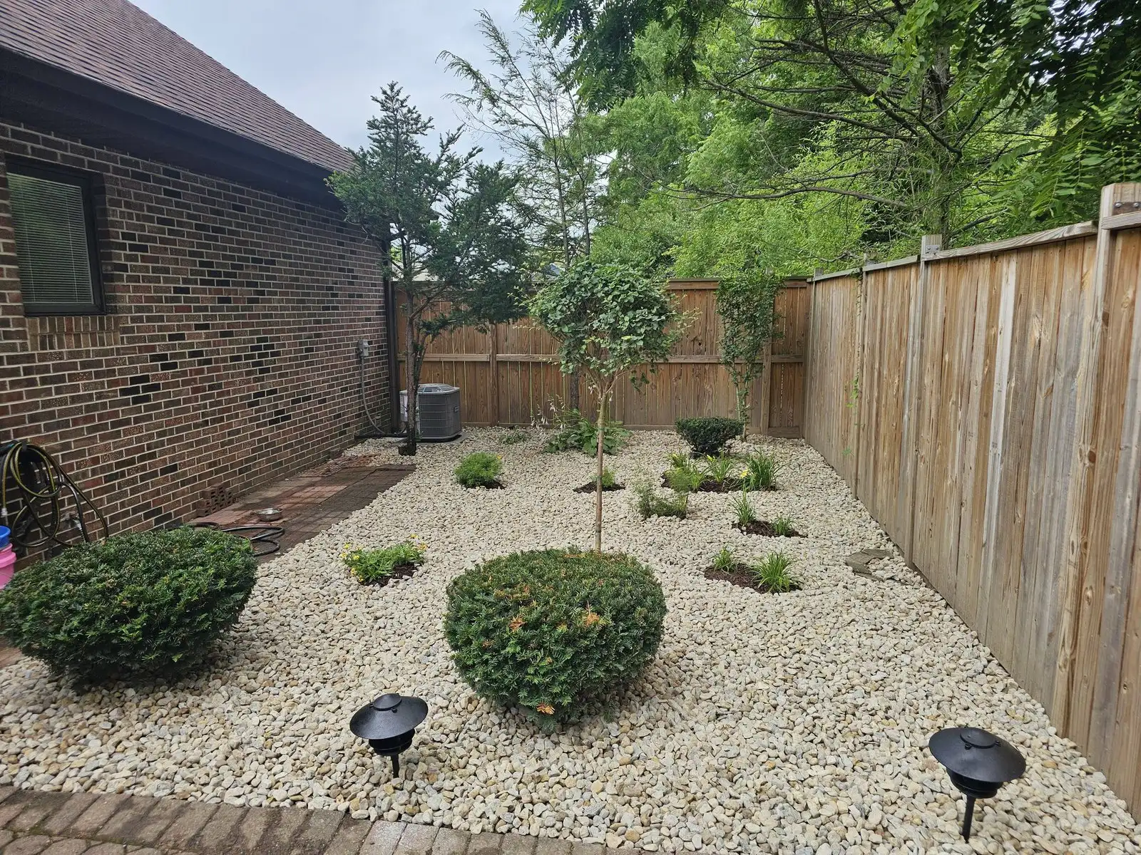 After: fenced side yard, cleaned up and re-landscaped